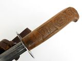 an image of a close up of a knife on a white surface