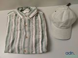 a hat, shirt, and baseball cap sitting on a table