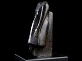 statue of a woman with a veil on her head on a black background