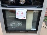 a black and silver oven with a price tag on it