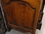 a small wooden cabinet with a drawer underneath it
