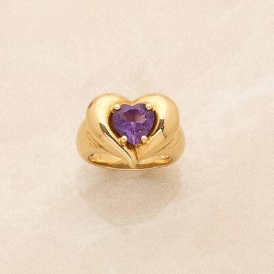 an image of a gold ring with a heart shaped amethorate