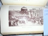 an open book with a picture of a crowd of people on it
