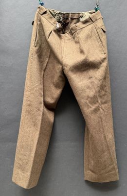 a close up of a pair of pants hanging on a wall