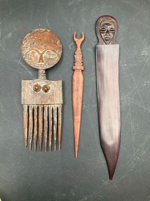 a knife, comb, and other items that are on a table