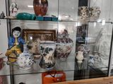 many vases on display in a glass case