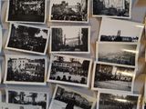 many old photos hanging on the wall of this room