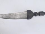 a knife that is laying on top of a table