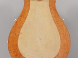 a wooden sculpture of a harp on a stand