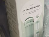 a box of breast milk and a bag of breast milk on a table