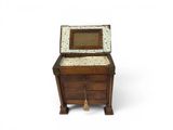 a small wooden chest with a drawer on it