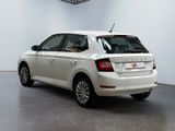 a picture of a white car parked in a garage