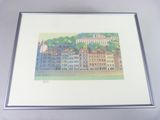 framed picture of a picture of a city with buildings and trees