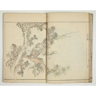 an open book with a drawing of a tree and a house