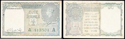a close up of two different bank notes on a black background