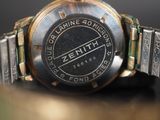 a close up of a watch on a table