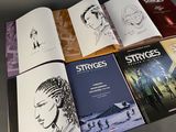 a lot of books that are sitting on a table
