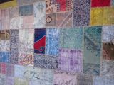an image of a patchwork wall hanging on a wall