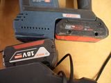 two power tools that are sitting on a table