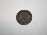 a close up of a coin on a white surface with a white background