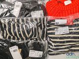a pile of clothing that is sitting on a table