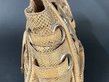an image of a purse made out of woven fabric with metal handles