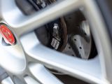 a close up of a tire with a red emblem on it