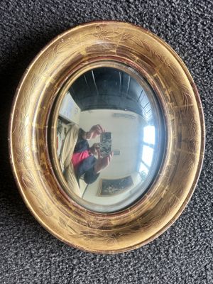Miroir sorcière de forme ovale - encadrement en bois doré du…