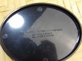 a black plate with a writing on it sitting on a table