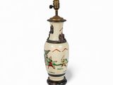 an image of a white vase with a bird on it