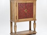 an image of a wooden cabinet with a red door