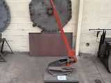 a machine that is sitting on the ground in front of a wall