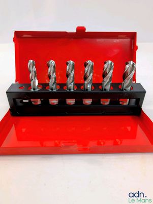a close up of a set of drill bits in a red case