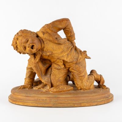 statue représentant un garçon et un chien sur un socle, avec un fond blanc