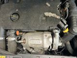 a picture of a car engine with its hood open