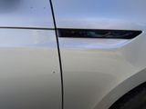 a close up of a car door handle with a sticker on it