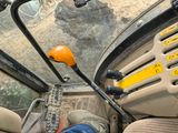 a person sitting in the driver ' s seat of a vehicle