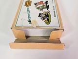a small box with a picture on it sitting on a table