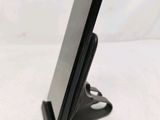 a cell phone that is sitting on top of a stand