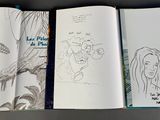 three pages of a comic book with drawings on them