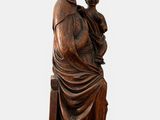an image of a statue of a woman holding a child