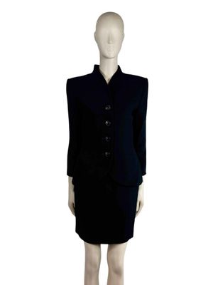 an image of a mannequin wearing a black dress and jacket