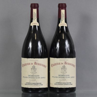 two bottles of wine sitting on top of a table next to each other