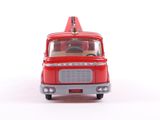 a red toy truck with a man in the back of it