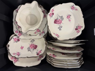 a stack of plates and bowls in a black box