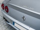 a silver car parked on the side of the street
