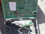 a tool in a case that is sitting on the ground