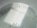 a close up view of a metal object with writing on it