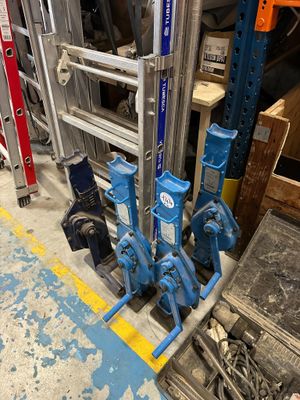 a ladder that is sitting next to a bunch of tools