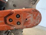 a close up of a chainsaw in a garage